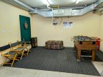 Foosball table and dart board in the basement garage.